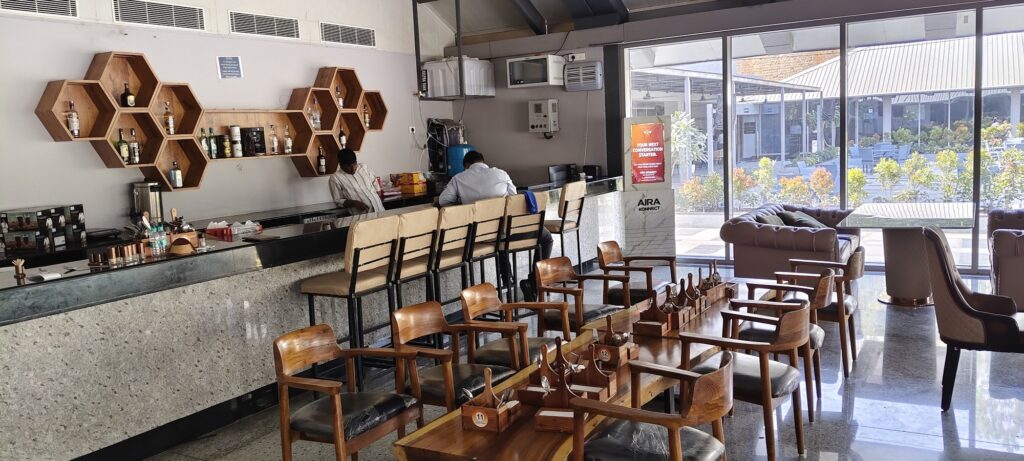 Aira Konnect digital screen beside a cafe counter and seating at MMCCC Jubilee Hills.